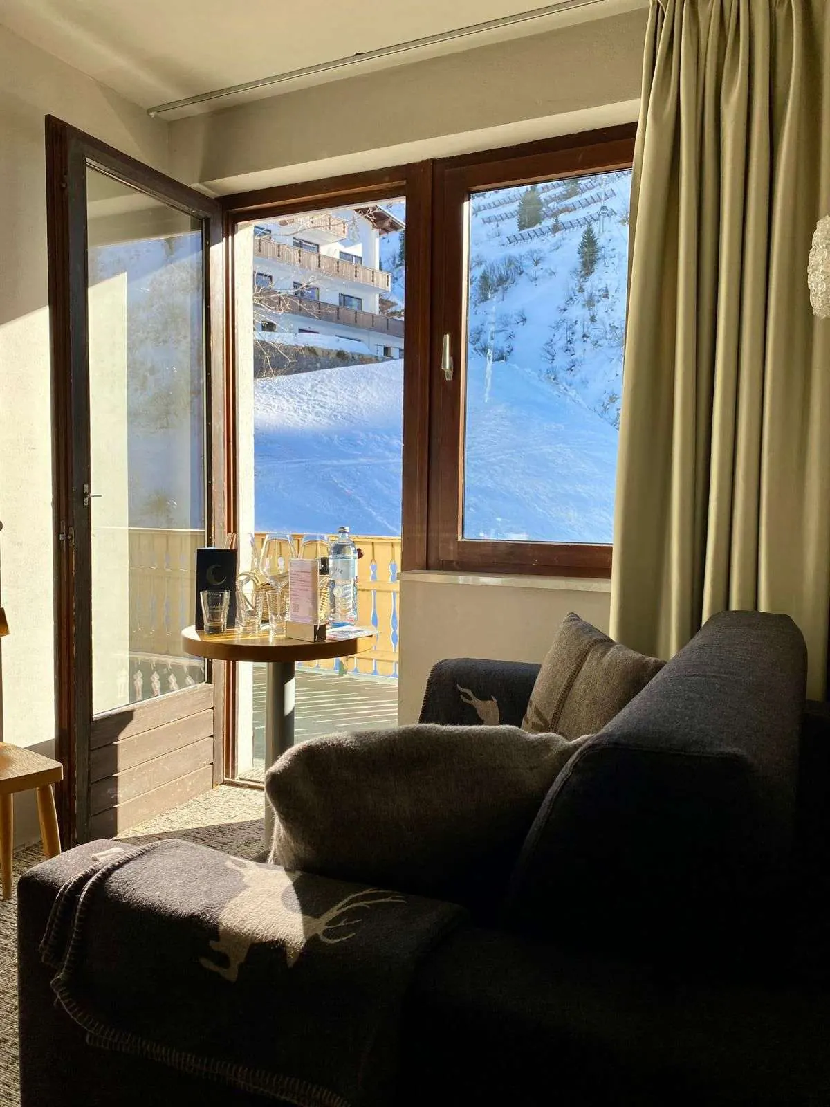 Apartment: living space with sofa and balcony door