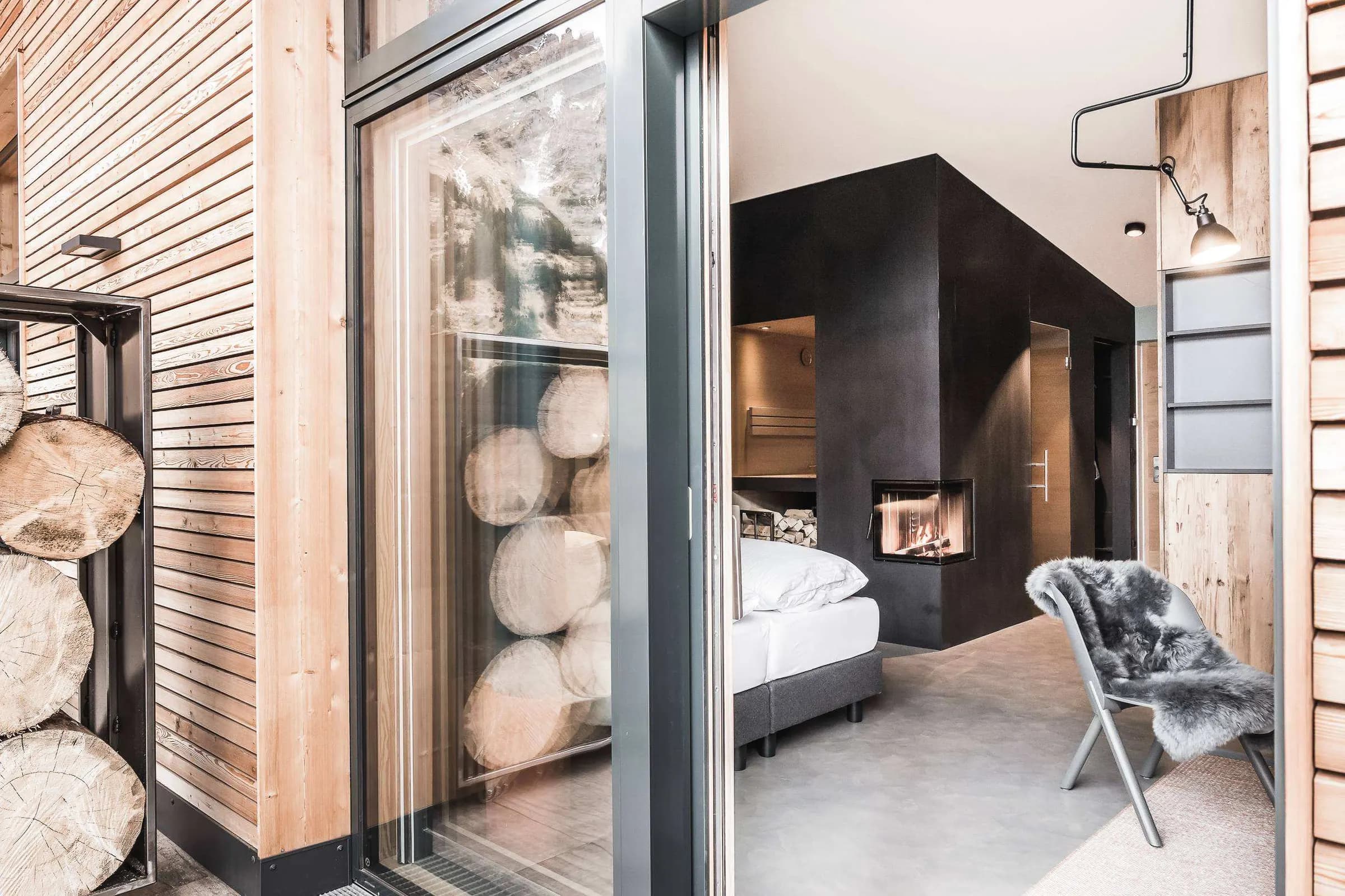 Suite with a black fireplace, wood and glass