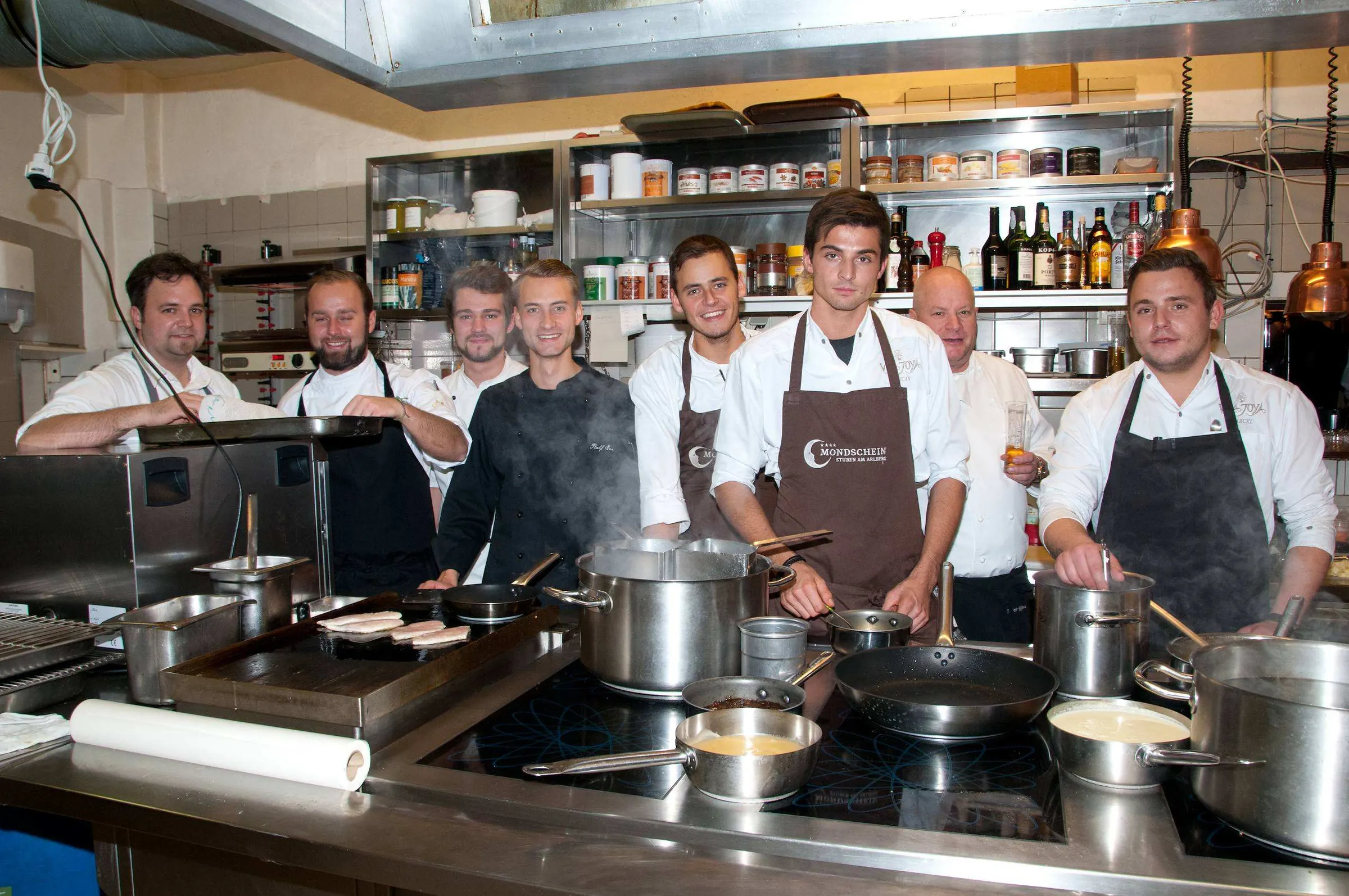 The kitchen brigade together at the stove