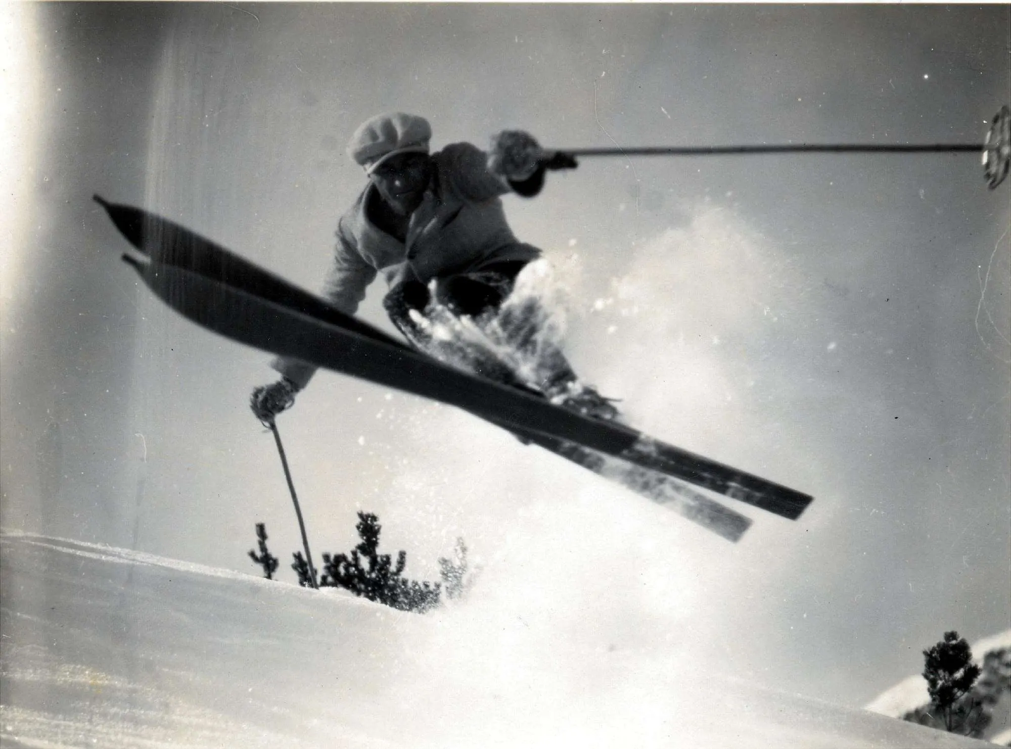 Skier in the air, photographed from below, historic photo