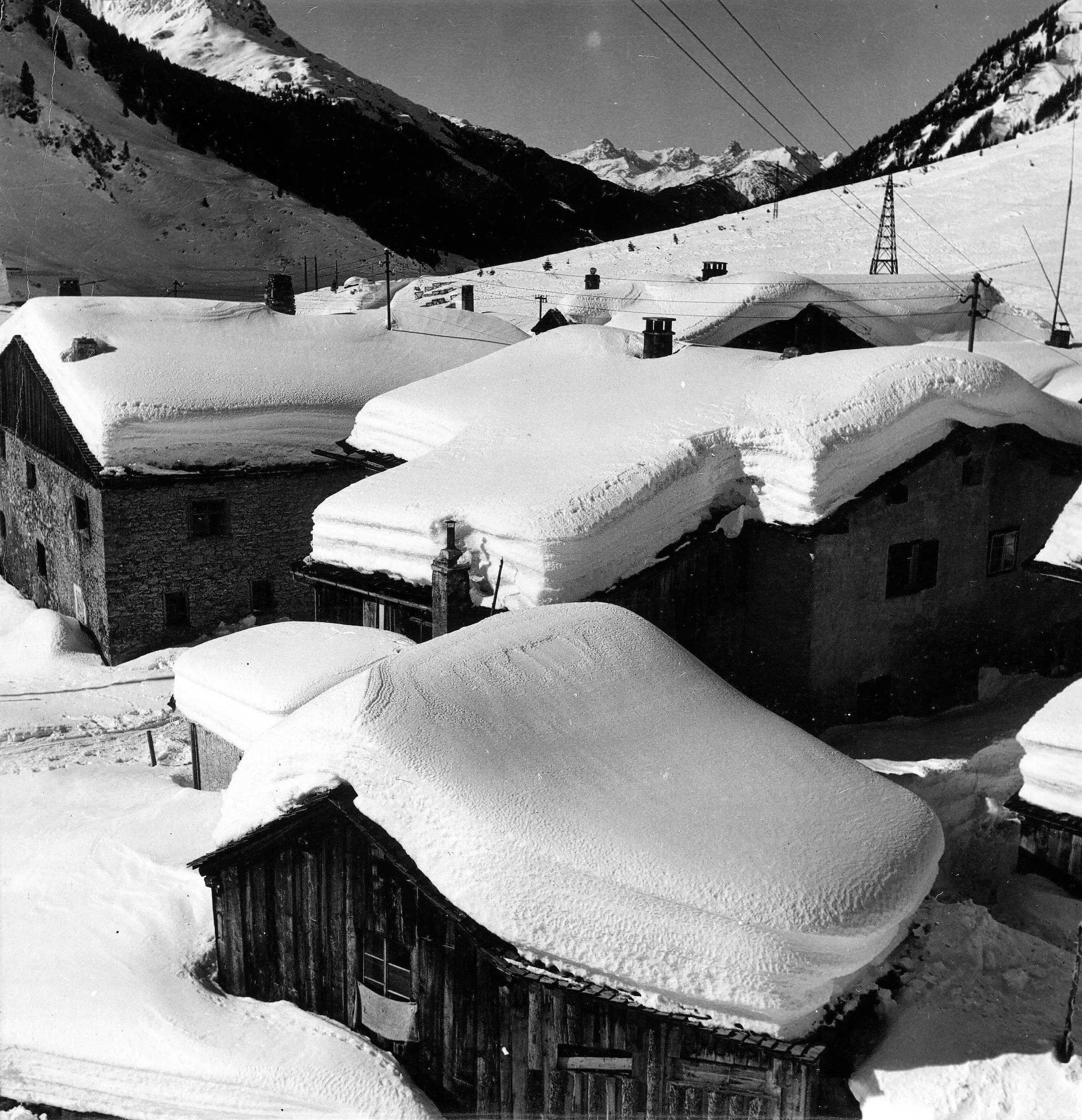 Houses under a thick blanket of snow, historic photo